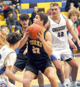 Forks Brody Lausch, center, looks for an opening surrounded by, clockwise from left, Terrell Emery of Crescent, LandinDavis of Forks, and Conner Ferro-May and Henry Bourm of Crescent on Wednesday in Joyce. (Keith Thorpe/Peninsula Daily News)