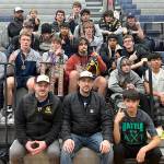 The Forks boys wrestling team celebrates its first-place finish at the Sgt. Justin Norton Memorial tournament held last weekend in Rainier. It is the second straight year the Spartans have won the tournament and it is the sixth tournament the boys have won this season. (Courtesy photo)