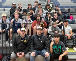 The Forks boys wrestling team celebrates its first-place finish at the Sgt. Justin Norton Memorial tournament held last weekend in Rainier. It is the second straight year the Spartans have won the tournament and it is the sixth tournament the boys have won this season. (Courtesy photo)