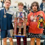 Three individual champions, Nate Dahlgren, Conner Demorest, and Sloan Tumaua.