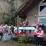 Staff members and clients celebrated the new Forks office - First Steps Family Support Center with a Forks Chamber of Commerce Ribbon Cutting last Friday. Holding the Big Scissors are Chamber Executive Director Lissy Andros and Elisia Anderson, Executive Director for First Steps. Photo Christi Baron.
