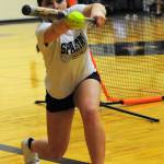Softball player Kaidence Rigby goes through bunting drills in preparation for the upcoming fastpitch season. Some 21 athletes are participating. Forks finished third in state last season. Photo by Lonnie Archibald