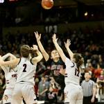 Neah Bays Amber Swan battles to get a shot off against Mossrock. Swan finished with 11 points and 11 rebounds in Neah Bays 56-54 win. (Bridget Mayfield/for the Peninsula Daily News)