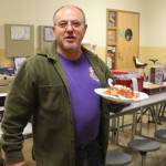 Giancarlo Buonpane was keeping his strength up to bid more with a delicious plate of food from the senior parent concessions stand. Photo Christi Baron