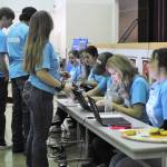 Forks seniors enter bids on an overhead projector during Saturdays Scholarship Auction at Forks High School. Photo by Lonnie Archibald