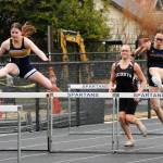 Peyton Johnson and Flora Horejsi compete in the 100 low hurdles. Photo by Lonnie Archibald