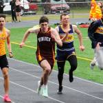 Ryan Anderson and Isaac Gonzales in the 100-yard dash. Photo by Lonnie Archibald