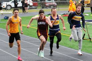 Ryan Anderson and Isaac Gonzales in the 100-yard dash. Photo by Lonnie Archibald
