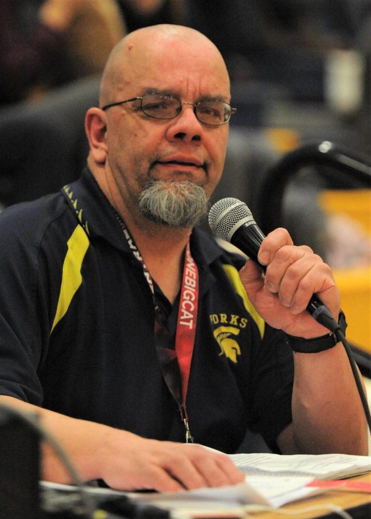 Pete Haubrick MCs the Forks vs Montesano basketball game in the Spartan Gym on Feb 11, 2020. Pete also announced the Forks football games at the old Spartan Stadium. The district dedicated the press box to announcer Haubrick, who died in 2021 and was known as the voice of West End sports. Photo Lonnie Archibald