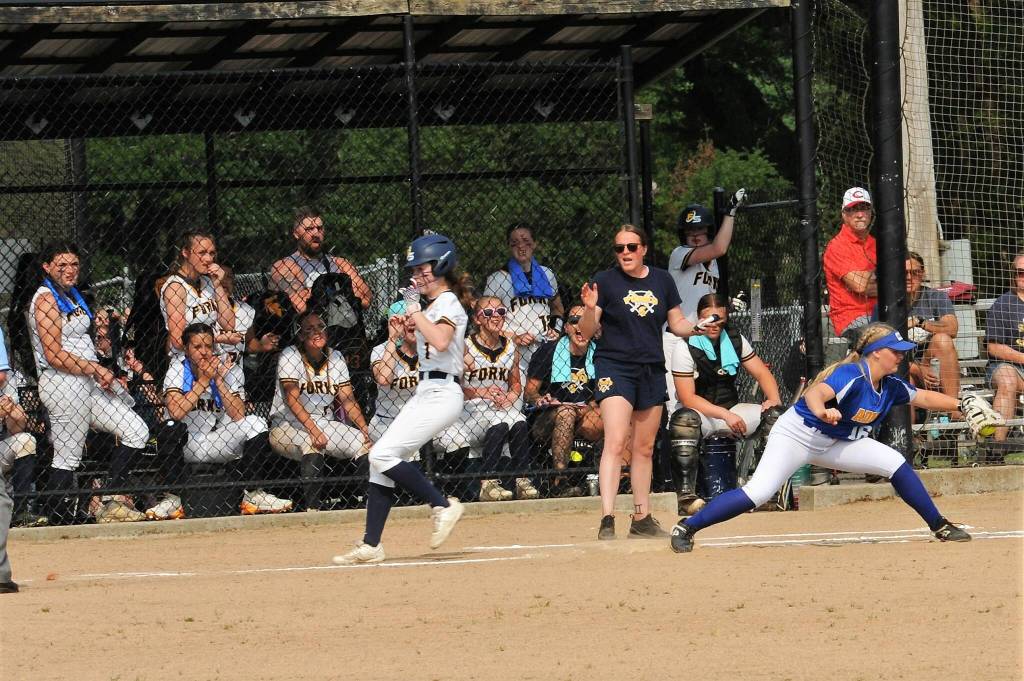 Spartan Bailey Johnson beats the throw to first during the Adna game won by Adna 9 to 1.