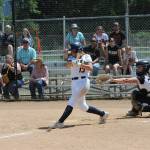 Forks Kendsie Thompson hits against Rainier.