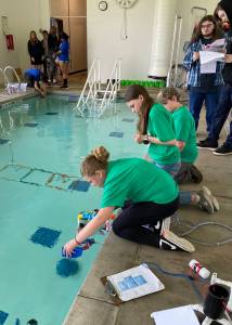 Forks Whales team conducts an ROV challenge in the pool.
Forks Whales team conducts an ROV challenge in the pool.