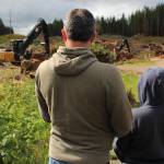 Clallam County Commissioner French and son Logan watch some logging activity on the La Push Road.