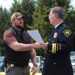 OCC Employee of the Year - Kris Oliver (left) with Superintendent Scott Speer.