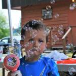 The Forks Elks Lodge held its annual Kids Hoe Down on Saturday, Aug 5 at the Lodge on Merchant Rd. The activity is funded through a grant and many activities were upgraded this year.
Three-year-old Hayden Ersband found this bubble machine to his liking Saturday afternoon at the Elks Hoedown. More photos on page 3. 
Photo by Lonnie Archibald