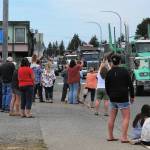 Many gathered along Forks Avenue as well as Bogachiel Way to honor the Joel Dahlgren Memorial procession Saturday afternoon. About 60 trucks took part, as traffic was stopped at times to allow for the column of trucks to remain unbroken. Photo by Lonnie Archibald