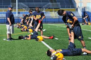 Spartan assistant coach Rob Rogers conducts exercises in preparation for the upcoming football season. Forks is scheduled to play Sequim at home on 
Friday, Sept. 1 beginning at 7 p.m., at the new Spartan Stadium. 
Photo by Lonnie Archibald
See story page 7