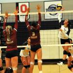 Chloe Gaydeski-St John hits while Keana Rowley, Haven Hoffman, Fynlie Peters, and Erida Williams look on. 
Photo Lonnie 
Archibald