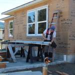 Houses are taking shape on Maloney Lane but more work needs to be done …A participant works last Friday to get siding on one of the homes before the winter rains arrive. If you have a few hours to spare come roll up your sleeves and join in this incredible effort which will result in five Forks families (a total of nine adults and ten children) achieving a crucial amount of financial stability by finally owning their own homes. No skills are required all sorts of help would be welcomed, from cleanup to assisting with more difficult tasks.With funding from USDA grants and overseen by Peninsula Housing Authority (PHA), this project empowers groups of families to collectively build homes for themselves and each other, using sweat equity and volunteer labor. Photos Christi Baron