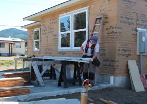 Houses are taking shape on Maloney Lane but more work needs to be done …A participant works last Friday to get siding on one of the homes before the winter rains arrive. If you have a few hours to spare come roll up your sleeves and join in this incredible effort which will result in five Forks families (a total of nine adults and ten children) achieving a crucial amount of financial stability by finally owning their own homes. No skills are required all sorts of help would be welcomed, from cleanup to assisting with more difficult tasks.With funding from USDA grants and overseen by Peninsula Housing Authority (PHA), this project empowers groups of families to collectively build homes for themselves and each other, using sweat equity and volunteer labor. Photos Christi Baron