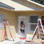 Several participants in the Mutual Self-Help build, on Maloney Lane, were prepping this house on Friday for painting that was to take place on Saturday.