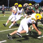 Spartan Landon Thomas attempts to bring down the Timberwolves running back while teammates Gage Willenbrink, Conner Roberts, and Walker Rondeau close in. Photo by Lonnie Archibald