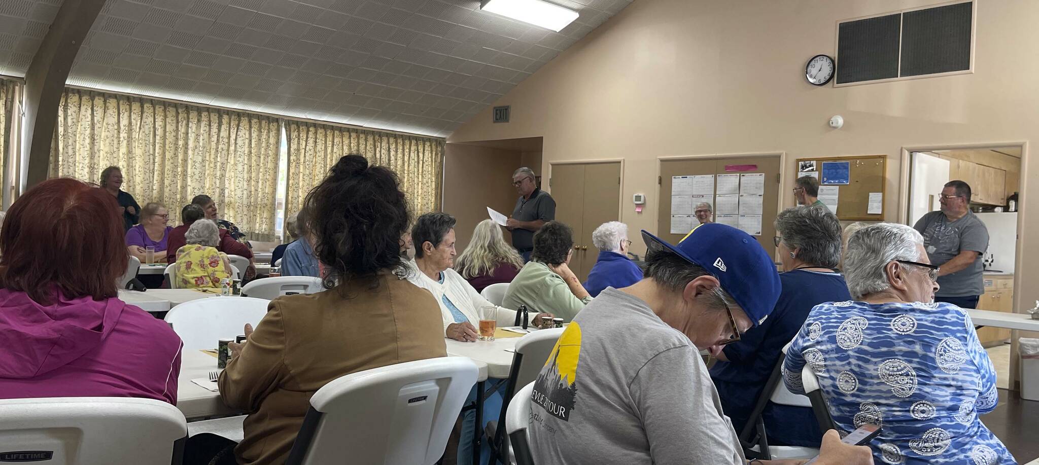 Pastor Warren Johnson shares some 
announcements at the monthly Senior Luncheon at the Forks Congregational Church, 
280 Spartan Ave., last Wednesday. 
Attendees enjoyed BBQ burgers 
with potato and macaroni salads with ice cream sundaes for dessert. 
The Senior Lunch takes place on the second Wednesday of the month and is Free! Doors open at noon and lunch service begins at 12:30 p.m. 
Photo Christi Baron