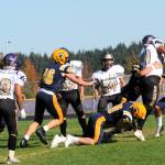 It was a strong defense that held the Friday Harbor Wolverines to only 6 points Saturday afternoon in Sequim. Pictured here bringing down the Friday Harbor runner are from left Brody Lausche, Landen Olson, Nate Dahlgren, and Kade Highfield. It was Forks 40 and Friday Harbor 6. Photo by Lonnie Archibald
