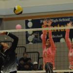 Spartans Erika Williams (left) and Keana Rowley go for the block of a Raymond-South Bend hit Oct 17 in the Spartan Gym as Forks wears pink in awareness of cancer. The Ravens took three straight sets by very close scores. Photo by Lonnie Archibald