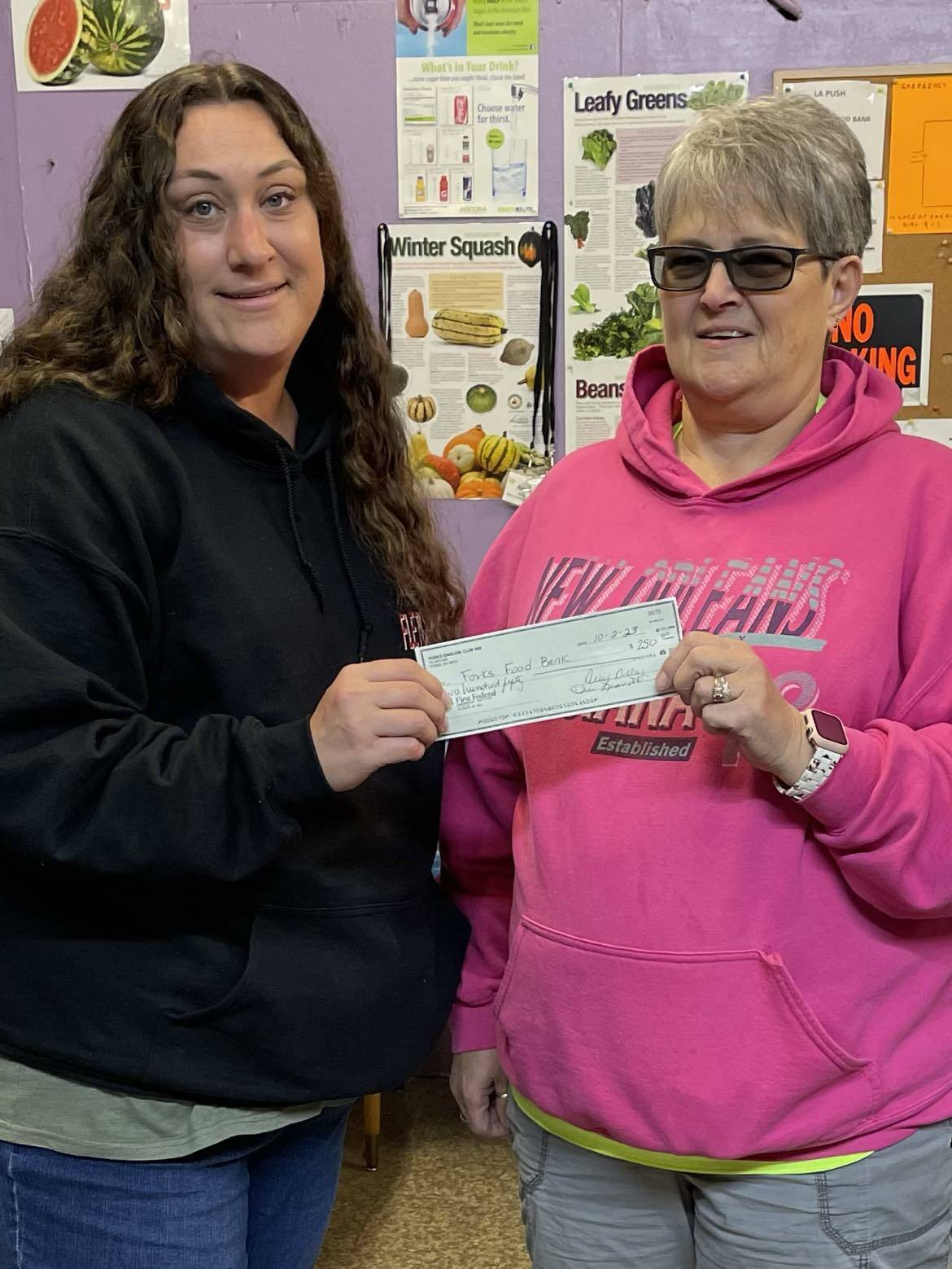 Forks Emblem Club #488 donated $250 to the Forks Food Bank on Oct. 3. Sena Engeseth from the Forks Food Bank is seen here accepting the check from Emblem Club member Teri Leavitt. Submitted Photo