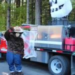 Smokey Bear is glad that the long dry summer is over and took a break by greeting truck or treaters on Saturday.