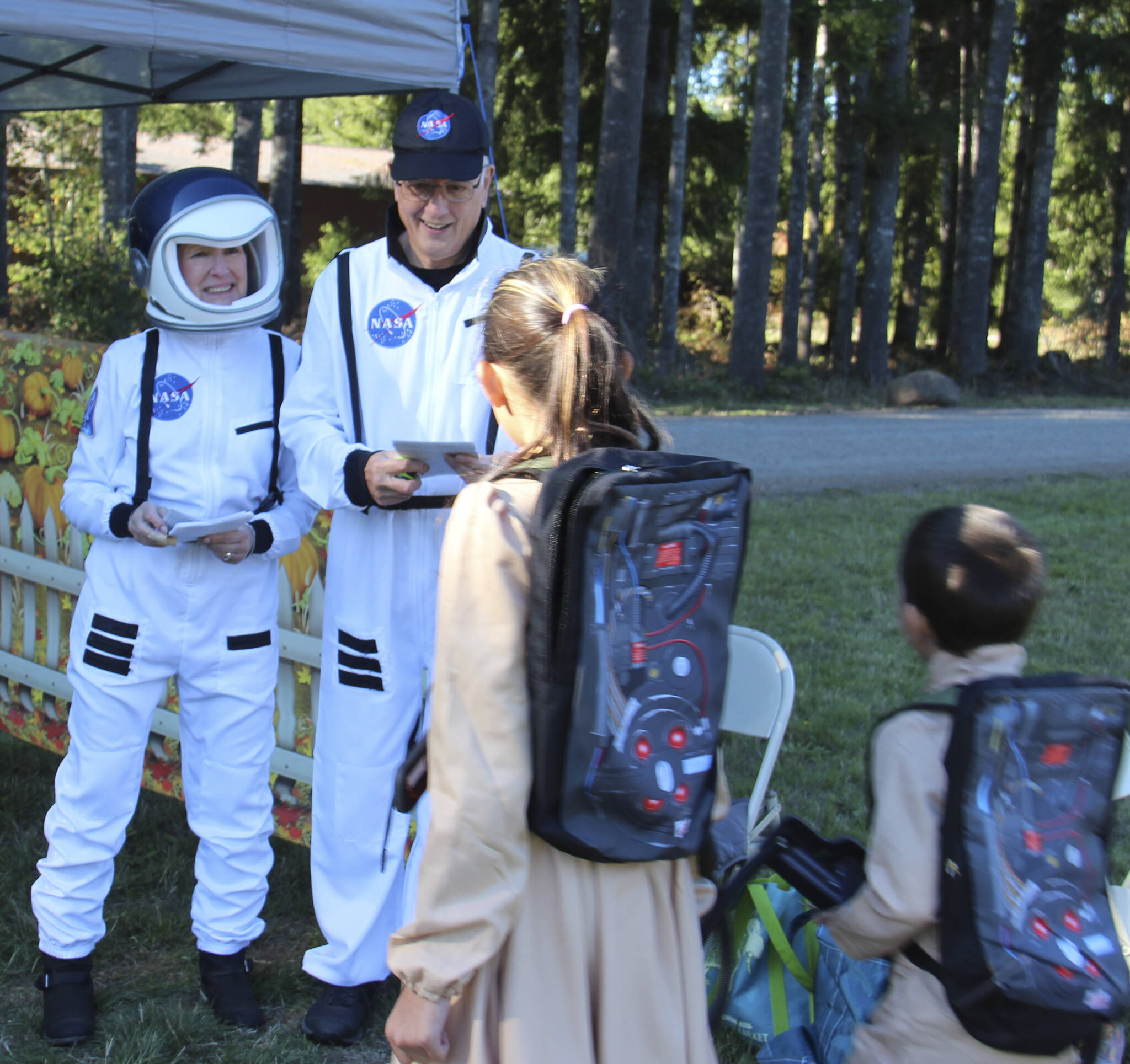 Greeters Linda and Stan were representing NASA as they welcomed a couple of Ghostbusters.