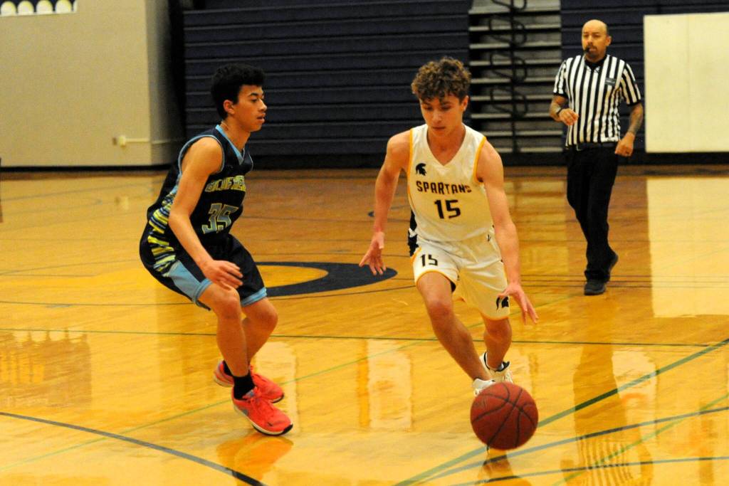 Driving on Blue Heron in 8th-grade action is Kingston Steffen (15). Photo by Lonnie Archibald