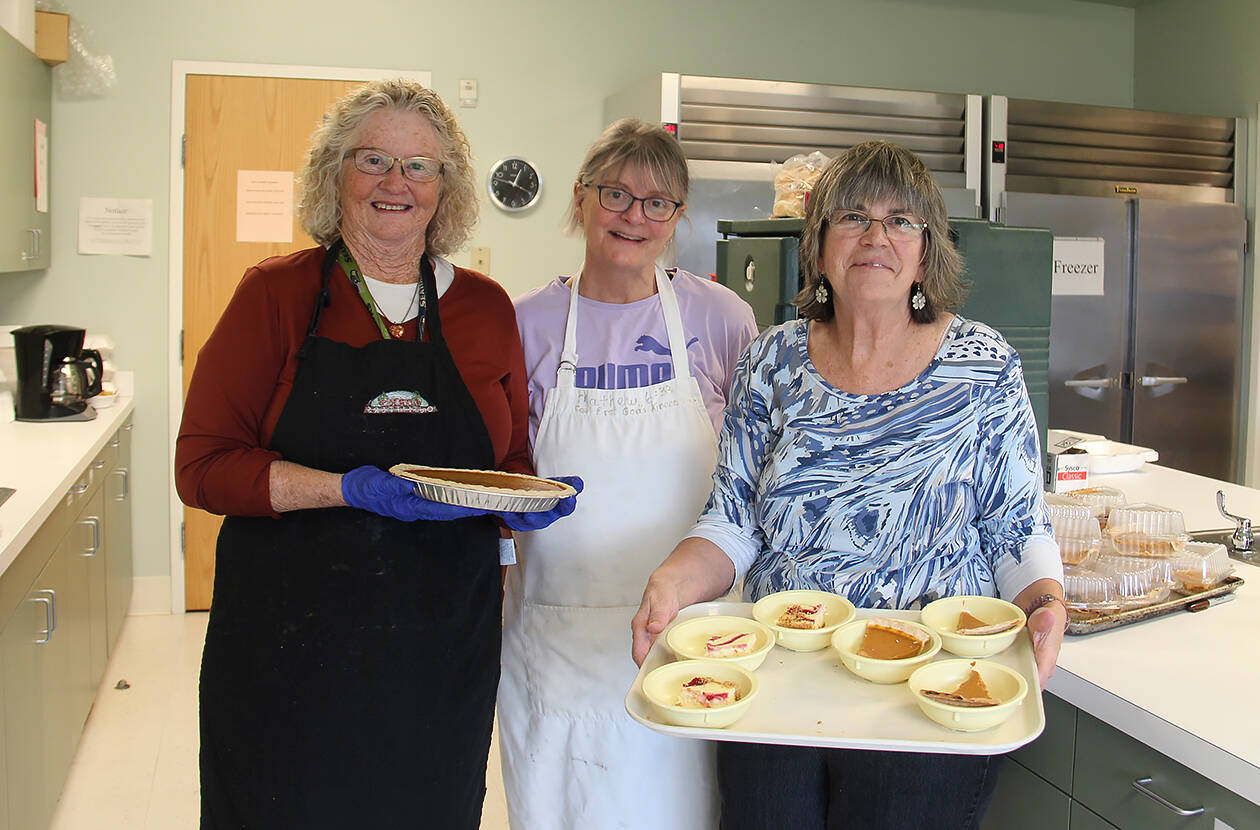 Feeding 5000 volunteers Sherry Schaff, Christie Stallman, and Debbie Anderson show off some of the desserts offered at last weeks Free Lunch at the Forks Community Center. 
Photo Christi Baron