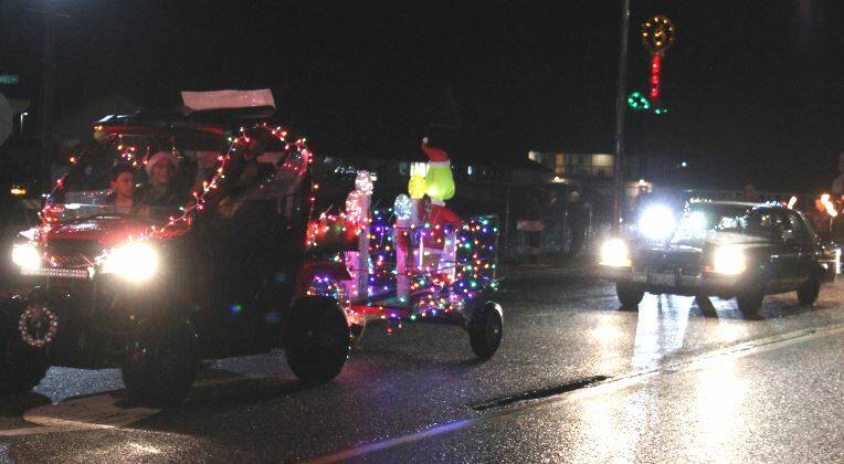 The Witherspoon family supported the parade with this entry, for some after-parade activities at Gingers Closet. It was a very Grinchy parade with many floats and costumes depicting the grouchy, grumpy green guy. Bill Plumley follows in his 1985 Cadillac Elks Mobile.