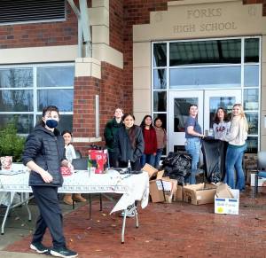 Forks NHS members surrounded by donations. Photo Cheryl Archibald