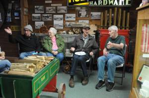 Richard Halverson shares a story at the Forks Timber Museum on Tuesday, Dec. 19. Shirley Sharpes listens while Bruce Paul and Tom Rosmond share a conversation. Halverson and Rosmond are on the Timber Museum Board. The Museum Board held its last meeting of the year at the Museum before hosting the West End Historical Society for lunch. Photos Lonnie Archibald