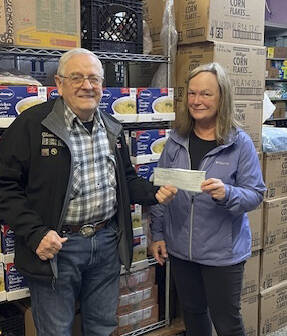 Forks Elks Lodge #2524 member Glenn King recently presented Forks Food Bank Executive director, Pat Soderlind, with a check for $1,500. The funds will be appropriated for future holiday food baskets. In addition to being an Elks member, King is also a Food Bank volunteer. Submitted photo