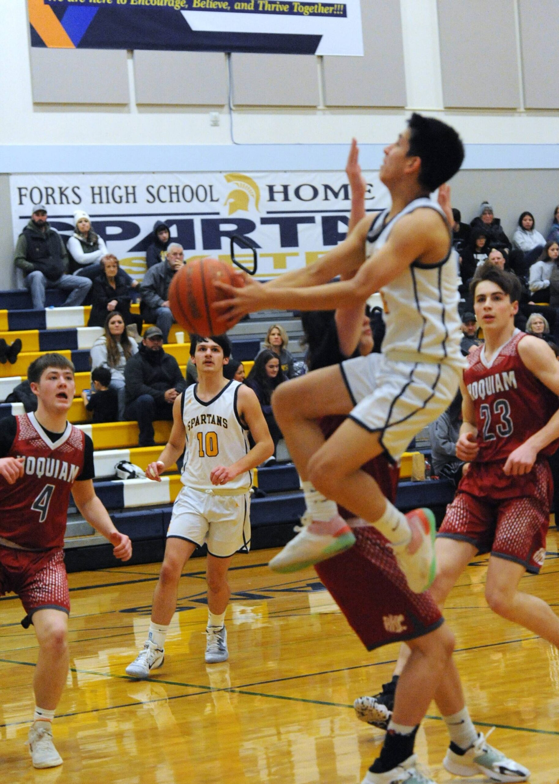 Forks Aiden Salazar drives while Dylan Micheau looks on. Photo by Lonnie Archibald