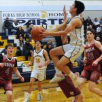 Forks Aiden Salazar drives while Dylan Micheau looks on. Photo by Lonnie Archibald