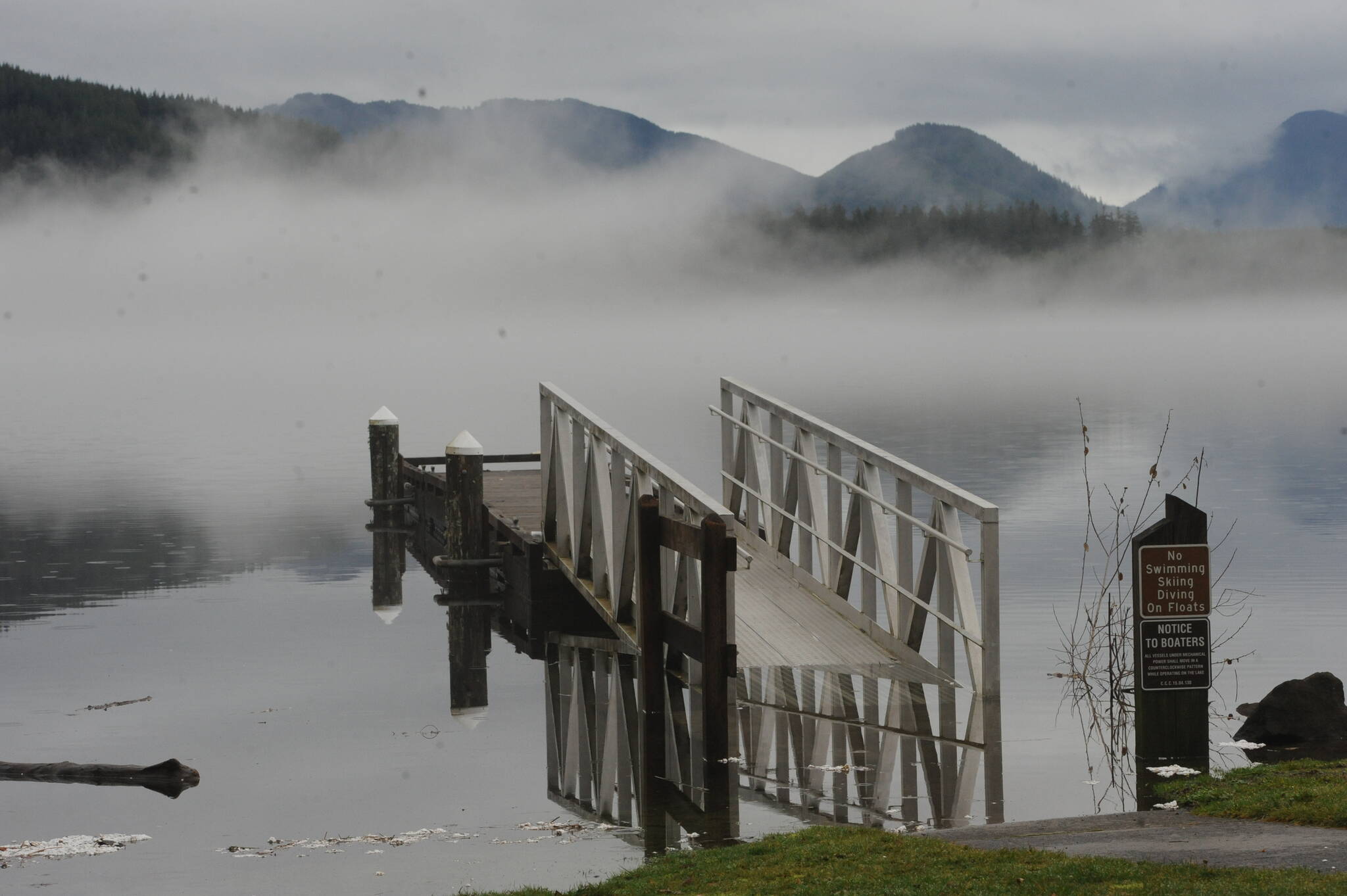 Two weeks ago in the Forks Forum, ice was seen covering the ramp to the float at Lake Pleasants Clallam County Park. By Saturday, Jan. 28 high water replaced the ice as rains came hard during the previous day and Sunday saw a high of close to 60 degrees. Over 4 inches of rain fell over the weekend. Pictured here the lake had risen partially covering the walkway to the float. Photo by Lonnie Archibald