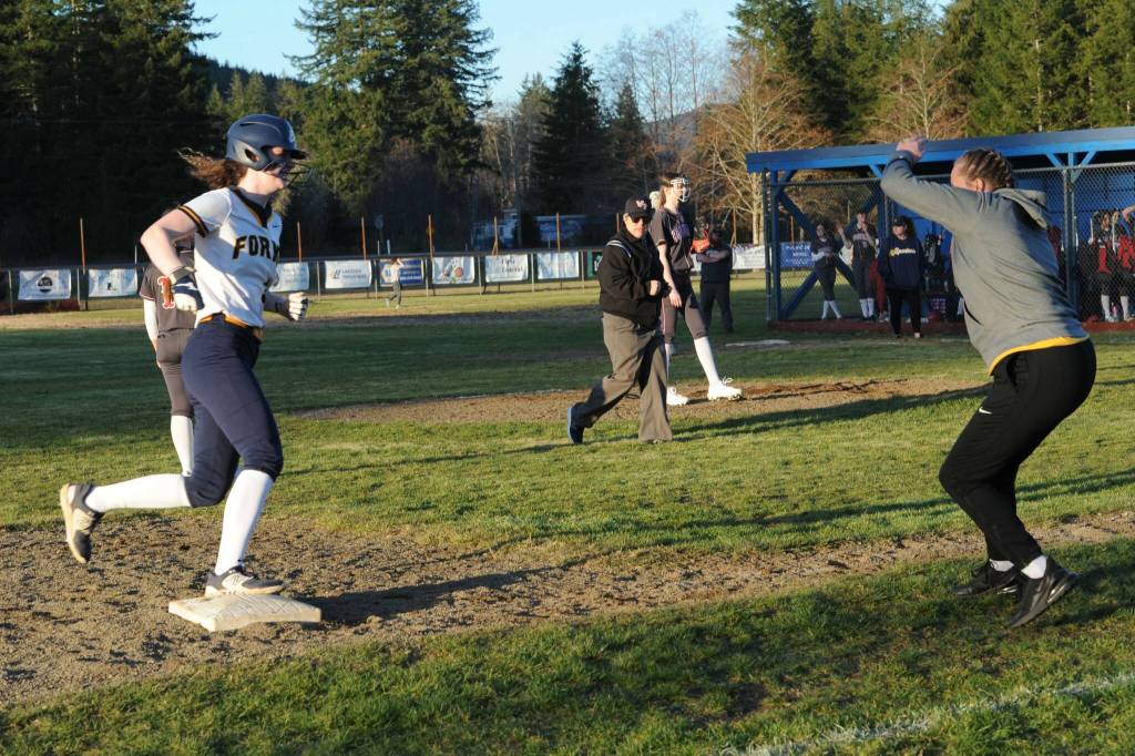 Forks Keira Johnson rounds third with her second home run of the day. Photo by Lonnie Archibald