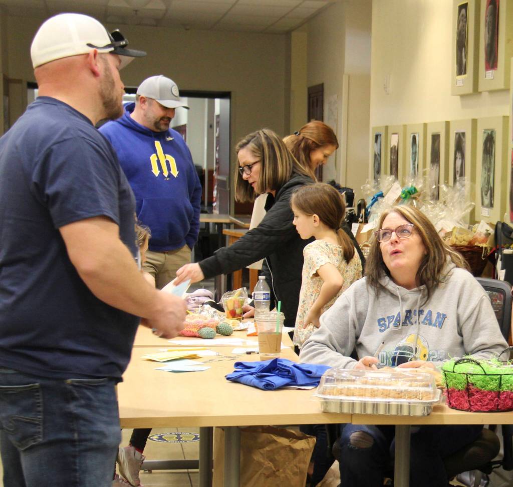 Shannon manned the donation check-in table on Saturday afternoon along with Nora and Kim.