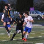 Spartans Mario Flores (21) and Jorge Diaz (25) control the ball. Also shown are Mateo Lucas (13) and Brody Owen (9). Photo by Lonnie Archibald