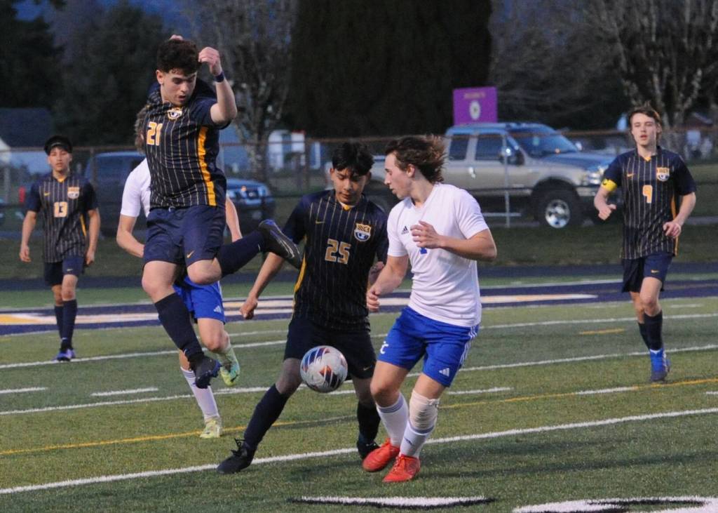 Spartans Mario Flores (21) and Jorge Diaz (25) control the ball. Also shown are Mateo Lucas (13) and Brody Owen (9). Photo by Lonnie Archibald