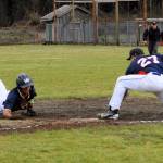 Bubba Hernandez Stansbury steals third base during the first game of the doubleheader. Photo by Lonnie Archibald