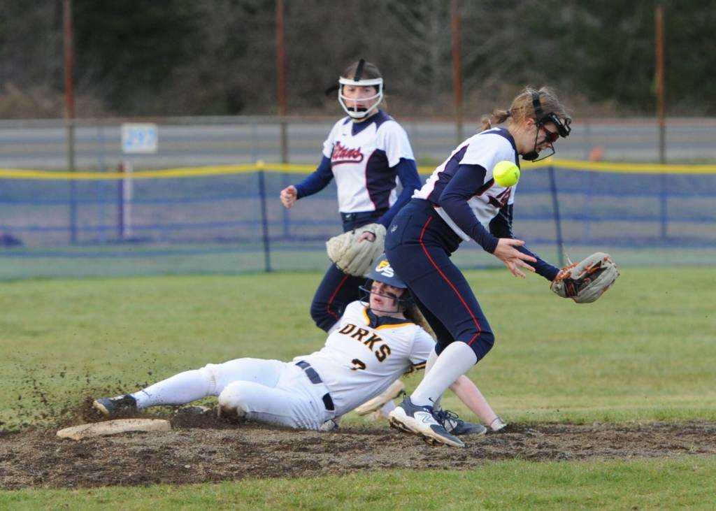 Forks Keira Johnson stole second base during the second game of the -. Photo by Lonnie Archibald