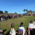 What a difference a year makes …last year Quileute students, tribal members and spectators battled wind and rain at the annual Welcome the Whales ceremony …this year the weather was amazing! Here students perform a dance and song as a very large crowd looks on. Submitted photo
