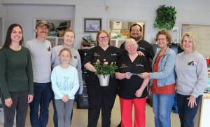 Honoring Dr. Pat Dowell on Saturday were Friends of Forks Animals members. Pictured are FOFA members Mariah Hoagland, Andrew, Shyliah and Hazel Gorbett; Dr. Pats Pet Care staff -Ashley Dowell, Dr. Pat Dowell, and Marty Person; and FOFA members Juanita Weissenfels and Pam Winney. Dr. Pat likes to garden, in her spare time, and FOFA presented her with a gift certificate to Rusty Gate Nursery. Photo Christi Baron
