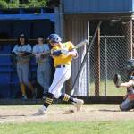 Spartan Dylan Micheau connects against North Beach pitching during the first game of this double header won by Forks. Photo by Lonnie Archibald